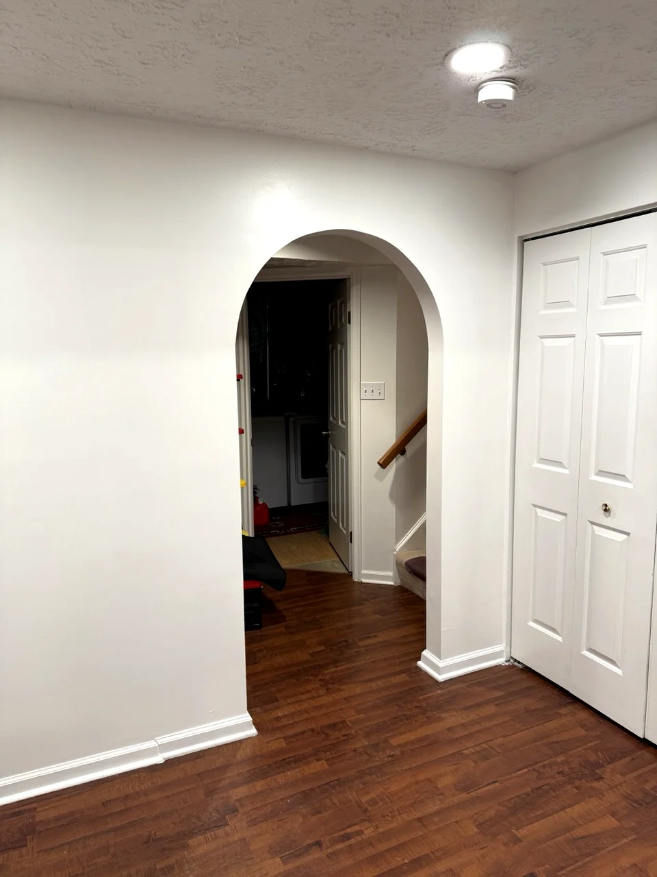 Finished drywall with custom arched doorway in Maryland home